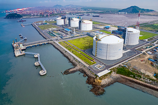 Aerial view of large LNG (Liquefied natural gas) tanks at LNG regasification terminal