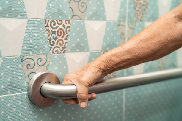 Asian senior or elderly old lady woman patient use toilet bathroom handle security in nursing hospital ward, healthy strong medical concept. stock photo