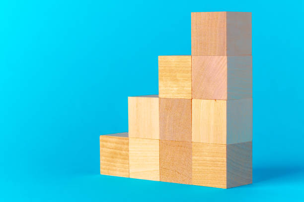 istock Toy wooden blocks on blue background front view 1414233800