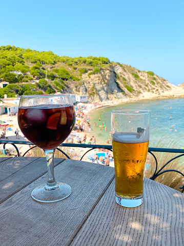 Photos of a beer and sangria in the beautiful Cala Portixol located in Javea, a good place for sightseeing.