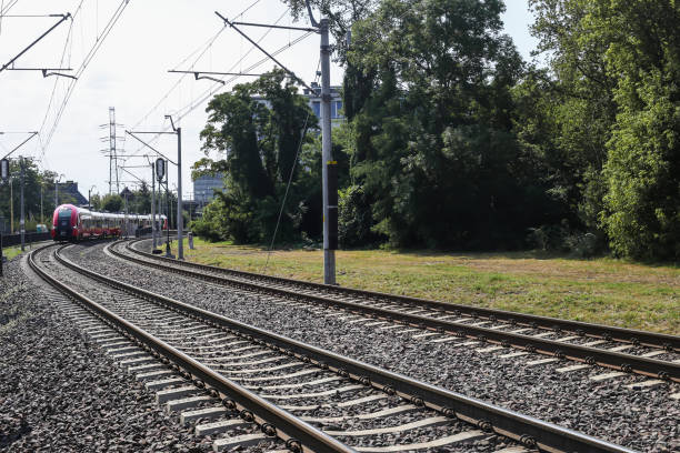 istock railroad passing through the city with an express train 1414236696