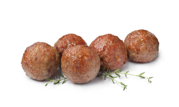 istock Many tasty cooked meatballs on white background 1414237508