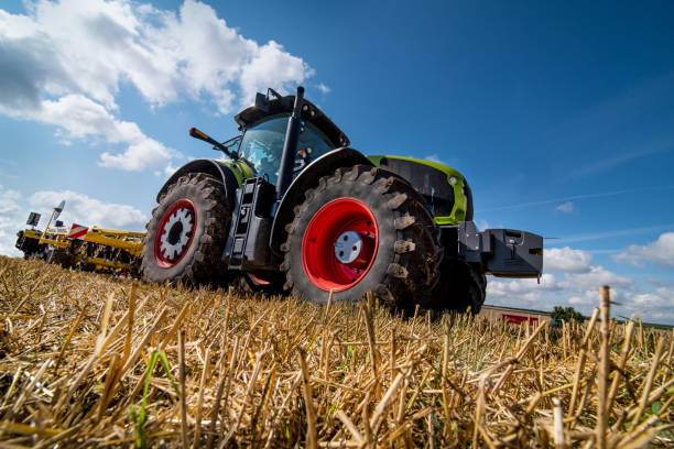 istock tractor in a field with stubble trailed equipment, bottom view 1414240152