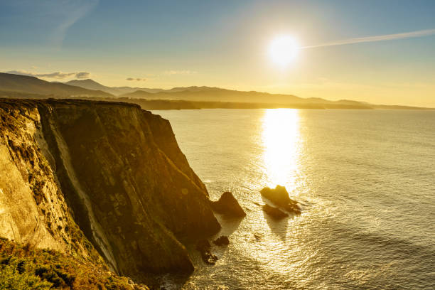 istock Asturias coast. Sunset over Cabo Busto cliffs, Spain. 1414245114