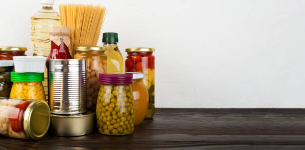 istock Emergency survival food set on dark wooden kitchen table 1414246178
