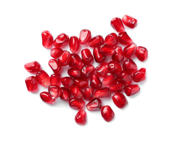 istock Tasty pomegranate seeds on white background, top view 1414246581