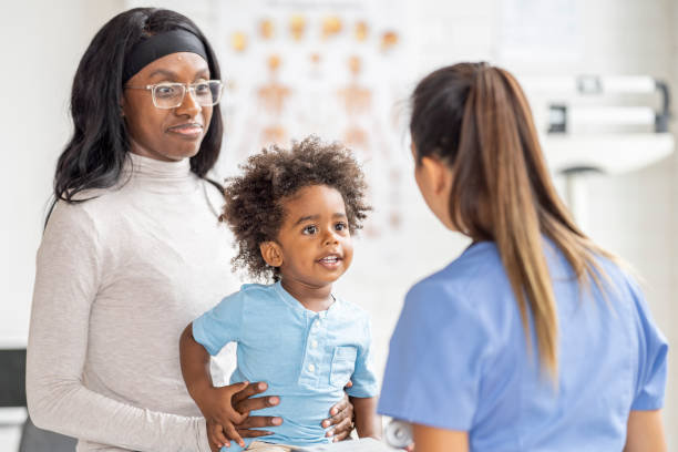 istock Mother with Her Son at the Doctors 1414249636