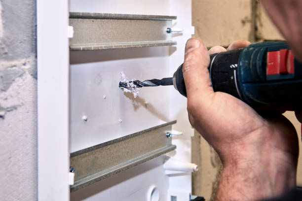 istock Power  drill at electrical work  is used to drilling hole in distribution board. 1414250820