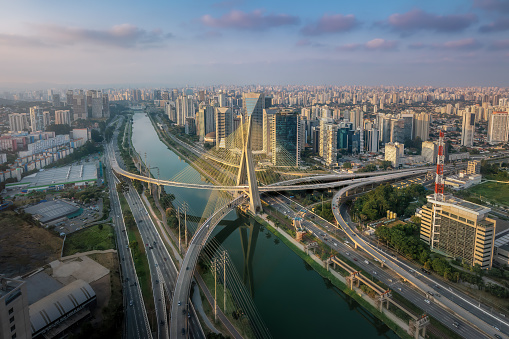 Aerial view of Octavio Frias de Oliveira Bridge (Ponte Estaiada) over Pinheiros River at sunset - Sao Paulo, Brazil