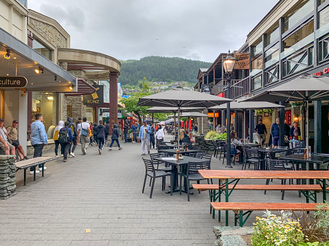 People walking at the Main Town Pier of Queenstown New Zealand, South Island.