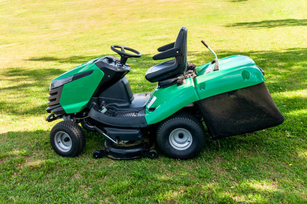 istock lawn mower on the green lawn 1414254923