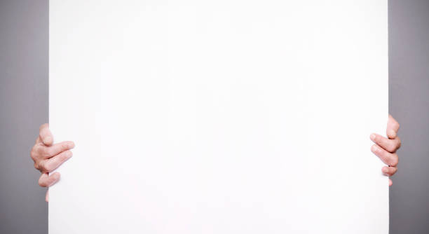 istock Man holding a blank sign. Copy space. 1414256617