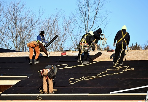 Roof construction crew in the winter.