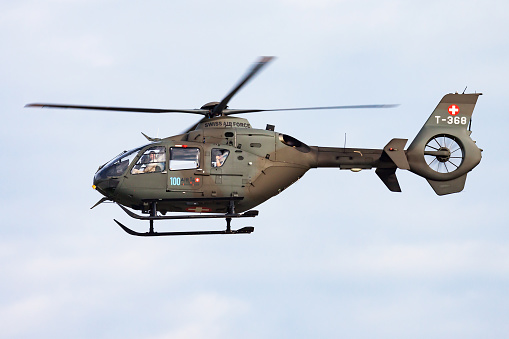Payerne, Switzerland - September 7, 2014: Military helicopter at air base. Air force flight operation. Aviation and aircraft. Air defense. Military industry. Fly and flying.