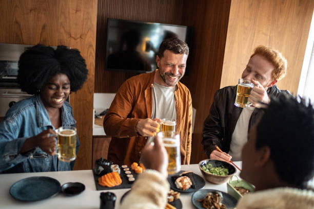 istock Friends toasting at home 1414258910