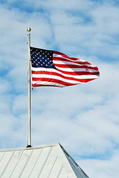 istock US Flag on the Roof 1414261316