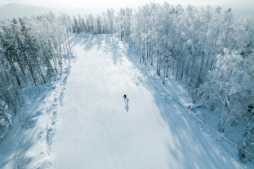 skier skiing down the mountain slope, ski slope and man. outdoor activities