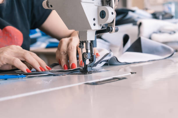 istock Seamstress at the sewing machine 1414263093