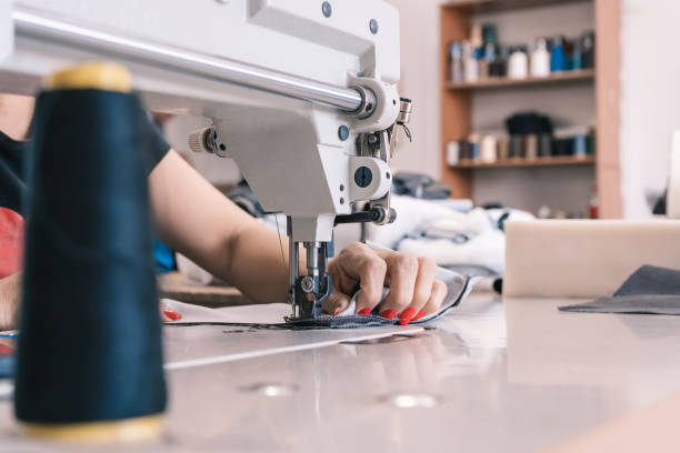 istock Seamstress at the sewing machine 1414263120