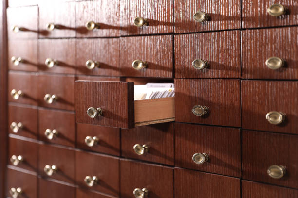 istock Open wooden drawer with index cards of library catalog 1414263638