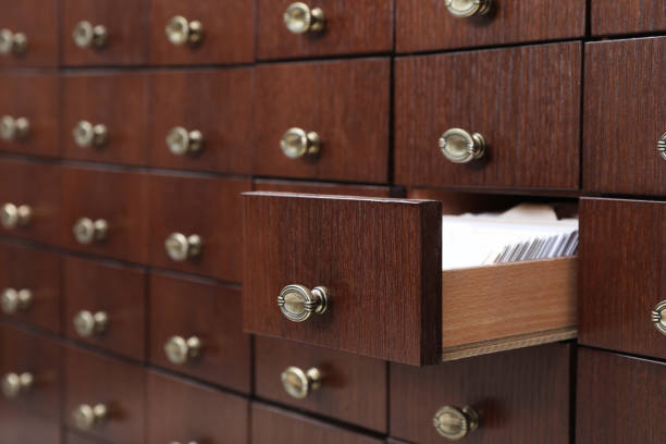 istock Open wooden drawer with index cards of library catalog 1414263649