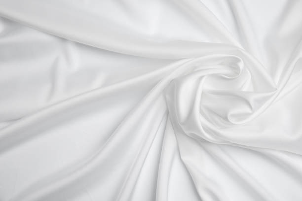 istock Texture of delicate white fabric as background, top view 1414264669