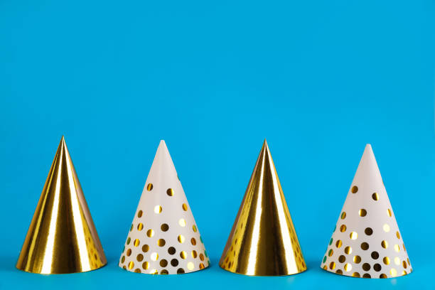 istock Colorful party hats on light blue background 1414265404