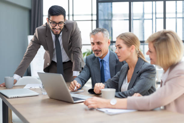 istock Group of business partners discussing ideas and planning work in office. 1414265505