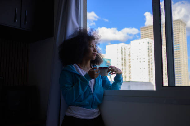 istock A woman drinking coffee at home 1414266332