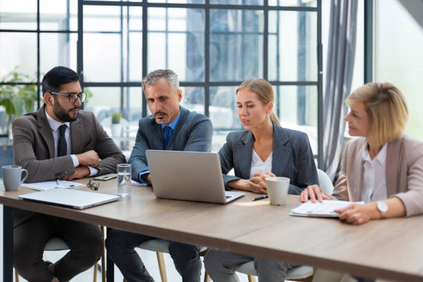 istock Group of business partners discussing ideas and planning work in office. 1414266507