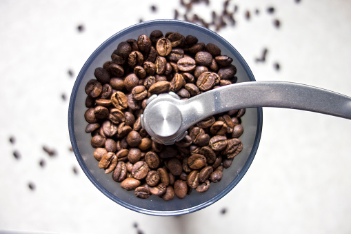 close up coffee beans in grinder