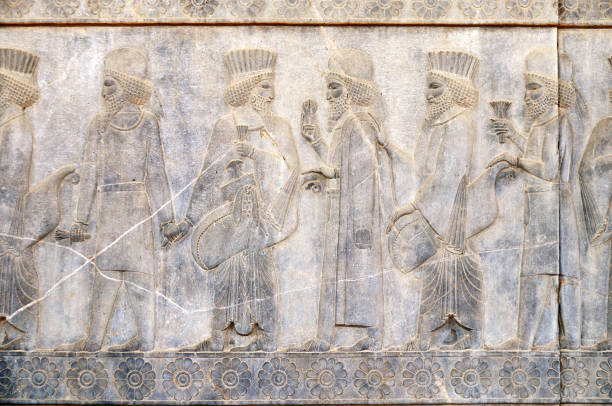 istock Ancient wall with bas-relief with assyrian foreign ambassadors with gifts and donations, Persepolis, Iran 1414270400