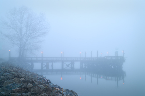 Fog blankets the No. 3 Road fishing pier in Richmond in the early morning.