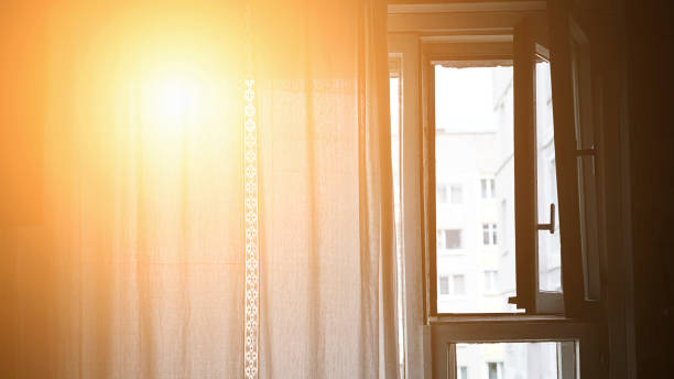 istock Bright sunlight is lit bedroom through fabric veil on window with open frame 1414273832