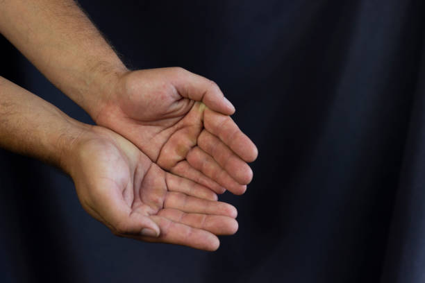 istock outstretched palms, begging, hunger and world crisis concept 1414275968