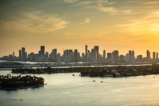 View of  the skyline of Downtown Miami, looking across the Venetian Islands, Palm and Hibiscus Islands ant the Port of Miami-Dade in Biscayne Bay from Miami Beach.  This image is part of a series of views taken at different times of day from the same location; a time lapse is also available.