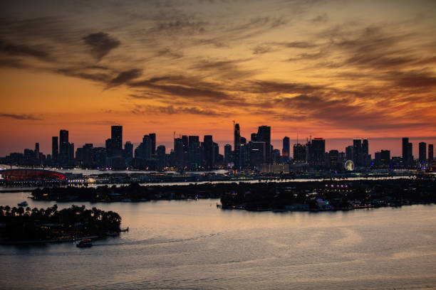 View of  the skyline of Downtown Miami, looking across the Venetian Islands, Palm and Hibiscus Islands ant the Port of Miami-Dade in Biscayne Bay from Miami Beach.  This image is part of a series of views taken at different times of day from the same location; a time lapse is also available.