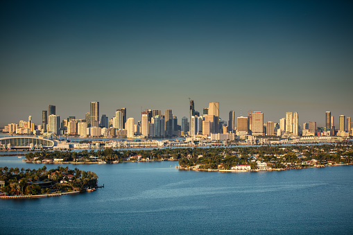 View of  the skyline of Downtown Miami, looking across the Venetian Islands, Palm and Hibiscus Islands ant the Port of Miami-Dade in Biscayne Bay from Miami Beach.  This image is part of a series of views taken at different times of day from the same location; a time lapse is also available.