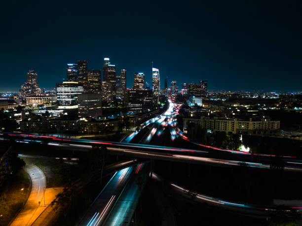 istock Blurred Traffic and Downtown Skyline in Los Angeles at Night 1414276298