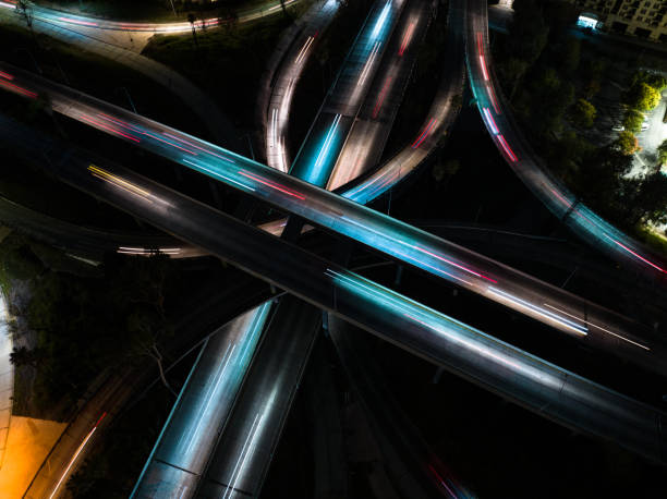 istock Top Down Drone Shot of Freeway Interchange at Night 1414276303