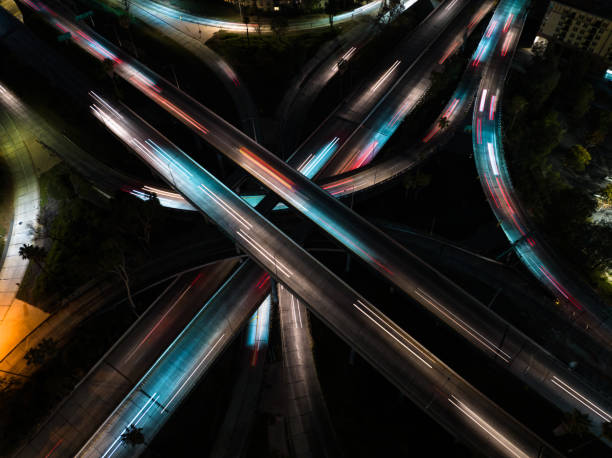 istock Abstract Shot of Cars on Freeway Interchange at Night 1414276307