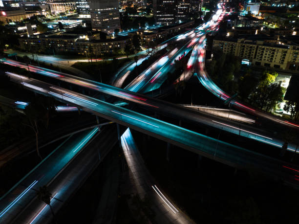 istock Freeway Traffic in Los Angeles at Night - Aerial 1414276311