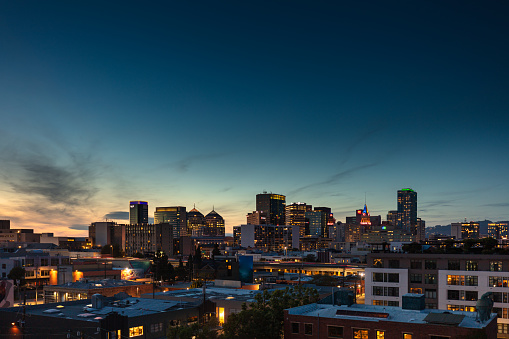The skyline of downtown Oakland, California on a summer evening. This still image is part of a series taken at different times of day from the same location; a time lapse is also available.