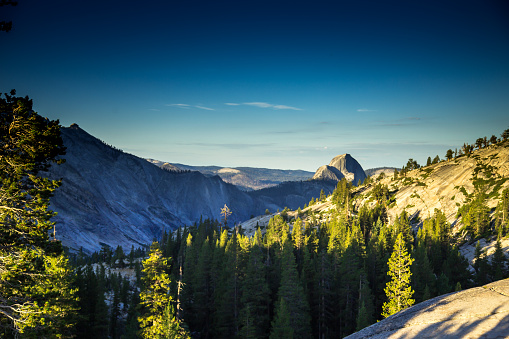 Stunning view of Yosemite Valley from Olmstead Point at sunrise on a summer morning, with Half Dome in the distance. This still image is part of a series taken at different times of day from the same location; a time lapse is also available.