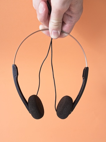 Vintage foam headphones used for personal music players from the 1980s and 1990s. Wired headphones as used with Walkman and other analog or digital music players.