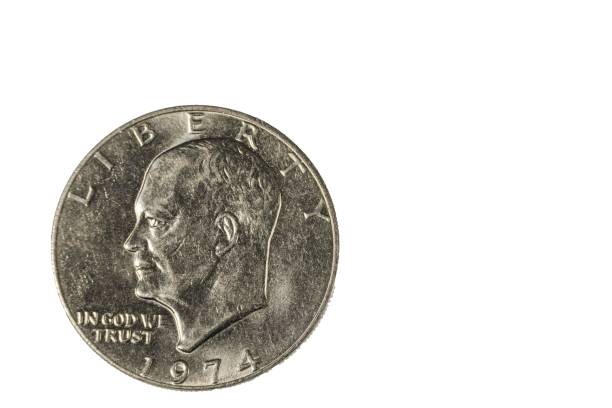 istock Close up of one dollar shaped coin dated 1974 on front side. Numismatic concept. 1414279207