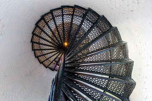 Spiral staircase within the historic Pensacola Lighthouse.  Concepts could include history, architecture, design, tourism, other.