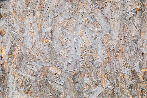 istock OSB material texture is a board made from recycled pressed wood shavings. Chipboard from large wood waste. Close-up 1414283869