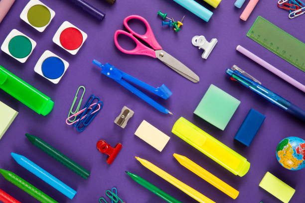 istock School Supplies on Purple Background 1414284127