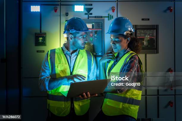 Electrical Engineer Use Laptop To Inspection And Testing Of Electrical System In Control Room Stock Photo - Download Image Now